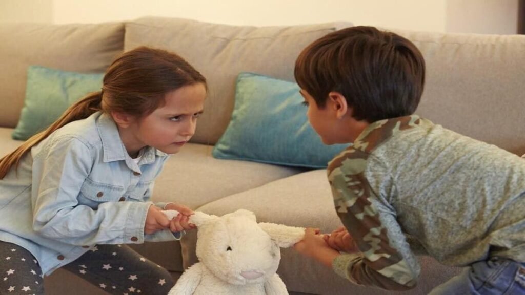 Two young children arguing over a plushie toy