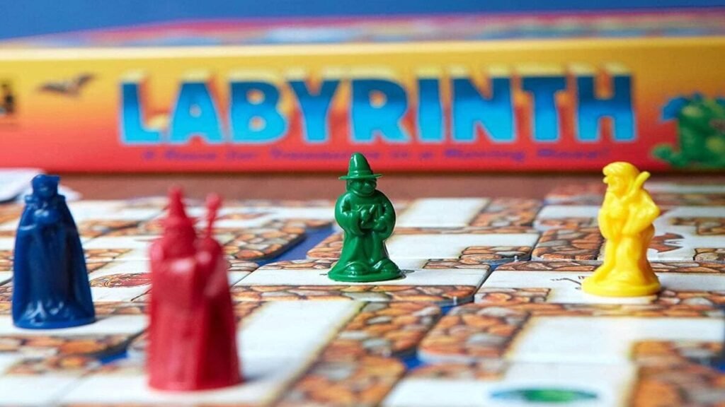 Four colourful meeples on the Labyrinth board game maze