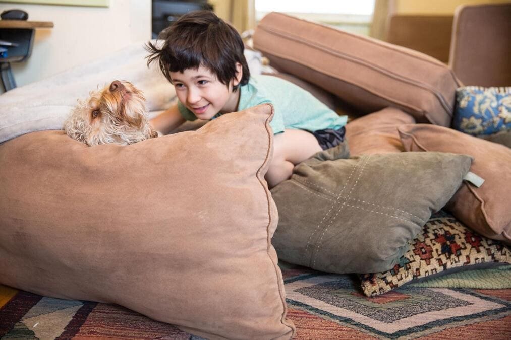 kids building blanket fort at home indoor activity