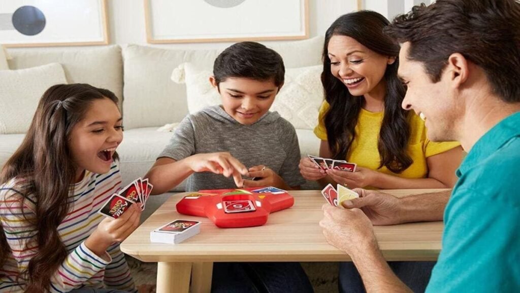 Kids playing Uno card game with colourful number and action cards