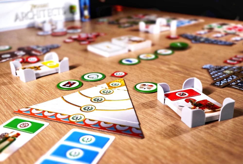 Family playing 7 Wonders Architects, a beginner-friendly civilisation board game for kids and adults