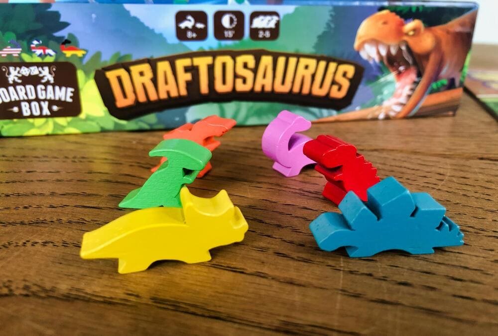 Children playing Draftosaurus, a dinosaur-themed drafting board game for kids and families