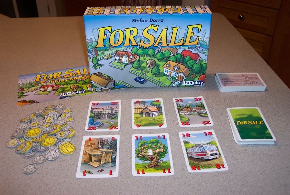 a table showing all the components of family board game for sale