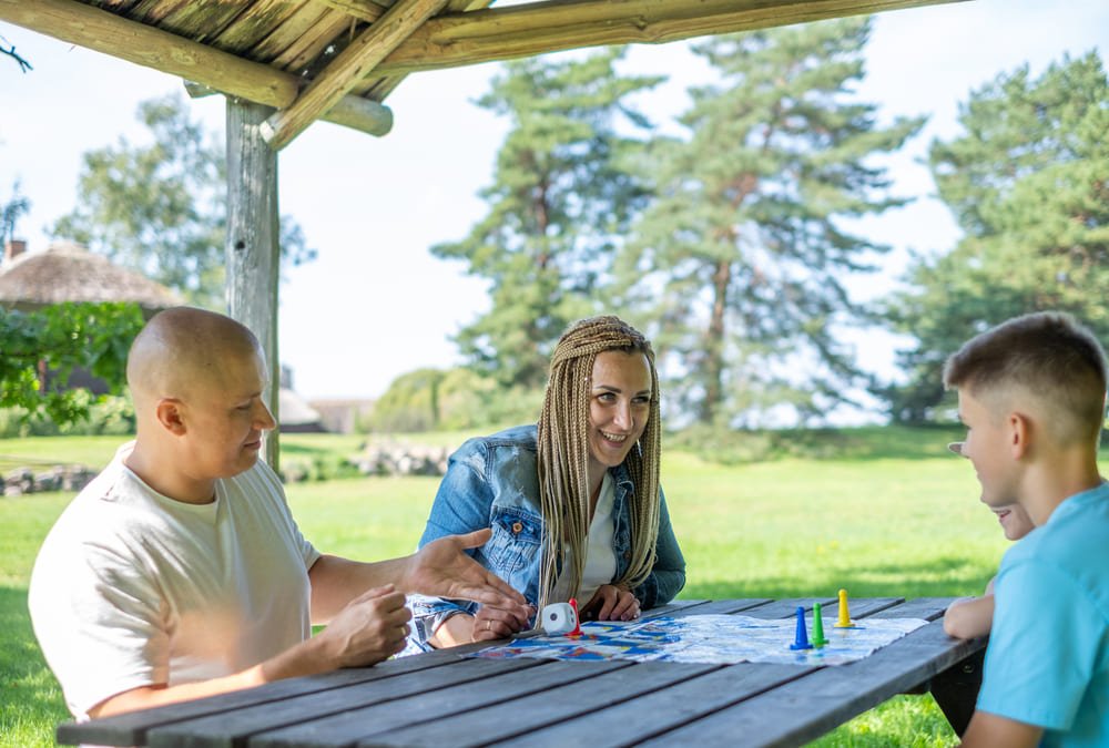 Family playing a fantasy adventure board game together