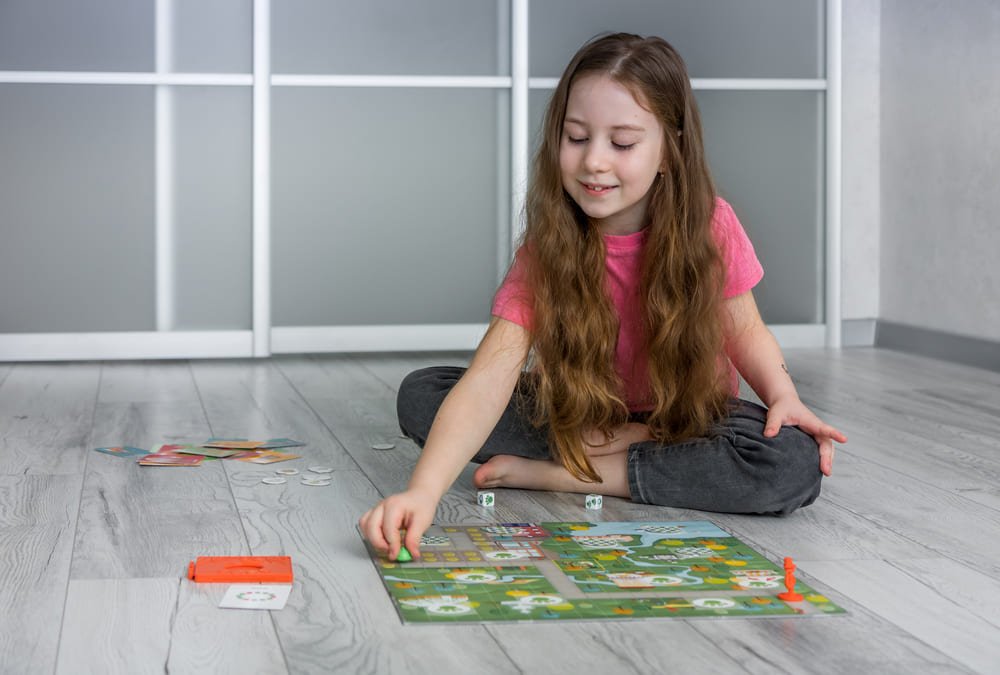 Girl playing Outfoxed as a solo detective game while solving clues independently