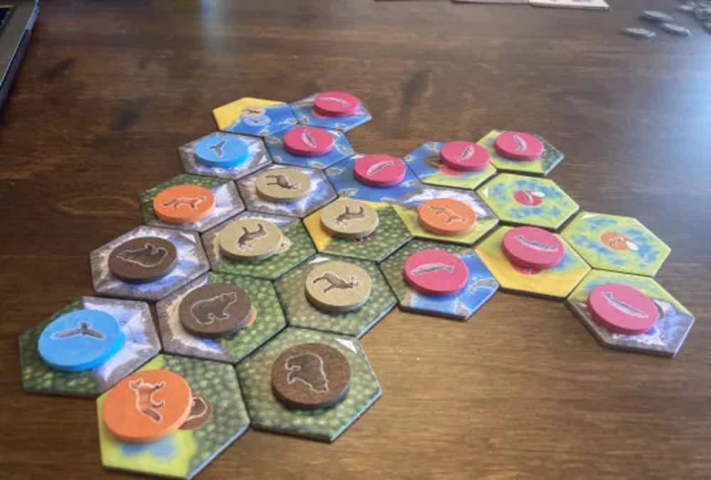 Cascadia wildlife board game with habitat tiles and animal tokens