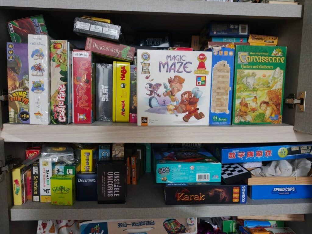 A home shelf of family board games owned and played by a Singapore parent