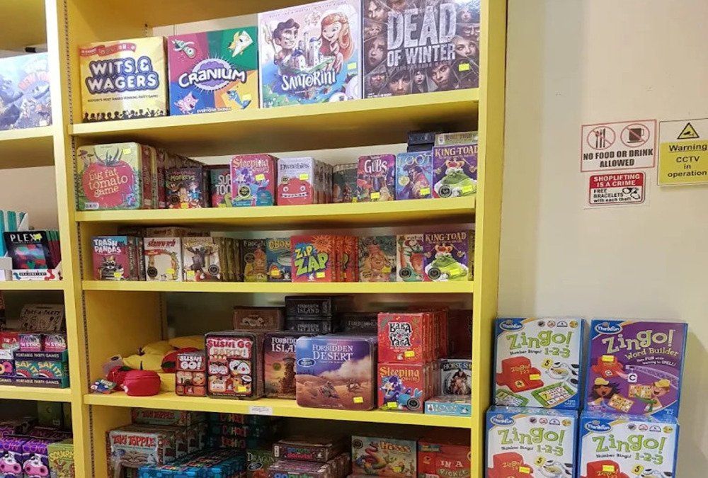 Where to buy board games in Singapore? A picture of a collection or board games in Singapore's local toy games store, with many well known publishers, available in store or online.